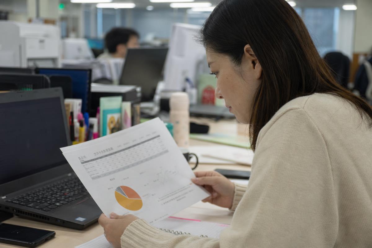 Marketing professional reviewing a campaign report